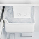 Close-up view of the built-in ice maker inside the FORNO 30-inch French door refrigerator from the 2-Piece Appliance Package, featuring a compact design with a clear ice bin—providing convenient, automatic ice production for everyday use.
