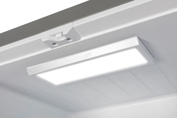 Interior view of the Forno 30-inch French door refrigerator in stainless steel, highlighting the built-in LED lighting that brightly illuminates the shelves and compartments for enhanced visibility and convenience.