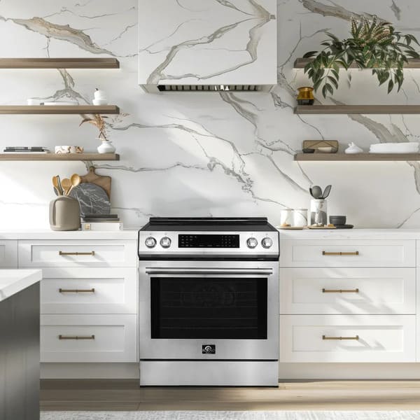 Lifestyle view of the FORNO 30-inch induction range in stainless steel, seamlessly integrated into a modern kitchen setting with surrounding cabinetry and stylish decor.