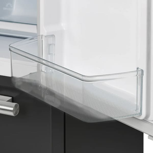 Close-up of a door bin inside the Forno 36-inch French door refrigerator, showcasing the transparent compartment ideal for storing bottles, jars, or condiments.