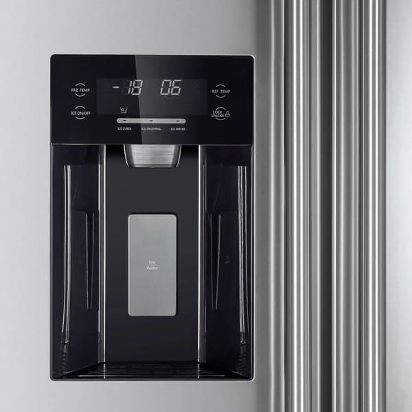 Close-up view of the built-in ice maker inside the Forno 36-inch side-by-side refrigerator with water dispenser, showing the compact ice bin and dispenser mechanism integrated into the freezer compartment for convenient ice access.