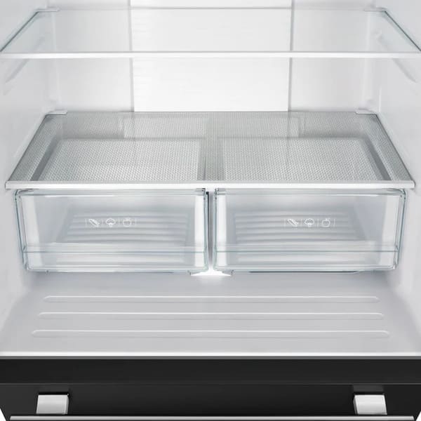 Interior view of the crisper drawer in the FORNO 30-Inch French Door Refrigerator in Black, designed with transparent materials to keep fruits and vegetables fresh and organized.