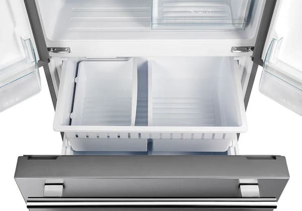 Close-up of the freezer drawers in the FORNO 30-inch French door refrigerator in stainless steel, highlighting the spacious dual-drawer freezer design for organized frozen food storage.