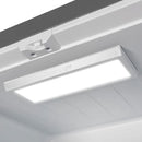 Interior view of the FORNO 30-Inch French Door Refrigerator in White, highlighting the bright LED lighting that illuminates the shelves and compartments for clear visibility.