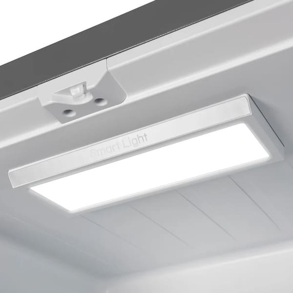 Interior view of the FORNO 30-Inch French Door Refrigerator in White, highlighting the bright LED lighting that illuminates the shelves and compartments for clear visibility.