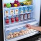 Interior view of the FORNO 31-Inch Refrigerator with Right Hinge in Black, highlighting the clear crisper drawers and adjustable glass shelves for efficient food organization.