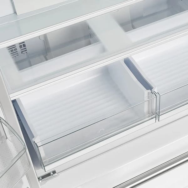 Interior view of the FORNO 36-Inch French Door Refrigerator in White, focusing on the transparent crisper drawers designed for storing fruits and vegetables.