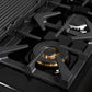 Close-up of a brass burner on the FORNO Antico 48-Inch Dual Fuel Range in black, showing precision flame ports, durable cast iron grates, and a sleek black stainless steel surface.
