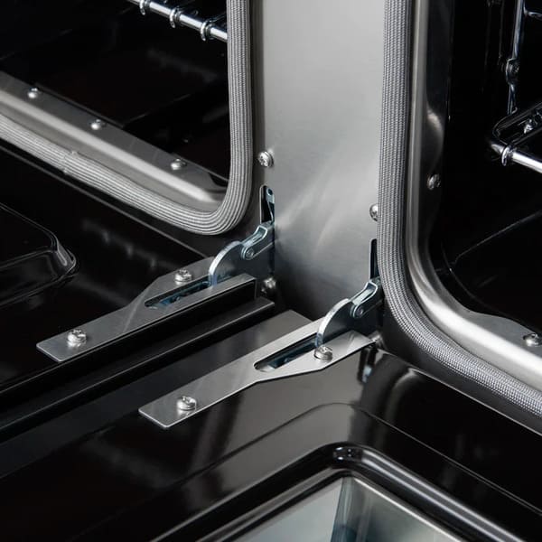 Close-up of the oven door hinges on the FORNO Antico 48-Inch Dual Fuel Range in black, highlighting the heavy-duty construction and smooth-opening mechanism for durability and ease of use.