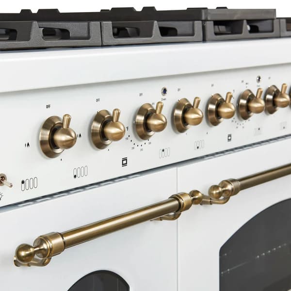 Close-up view of the control knobs on the FORNO Antico 48-Inch Dual Fuel Range in white, featuring polished brass bezels and precision-marked stainless steel knobs set against a sleek control panel.
