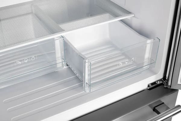 Close-up of the open drawers inside the FORNO 30-inch French door refrigerator in stainless steel, showcasing the ample storage space and smooth-sliding transparent compartments.