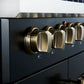 Close-up of the control panel on the FORNO Galiano 30-Inch French Door Dual Fuel Range in black, featuring zinc-coated metal knobs with bezel rings and LED backlighting for a premium look and precise control.