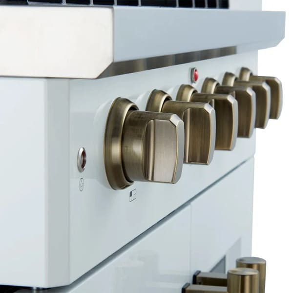 Left-angled close-up of the control panel on the FORNO Galiano 30-Inch French Door Gas Range in white, featuring stainless steel knobs with precise temperature markings and a matte white finish for a clean, modern look.