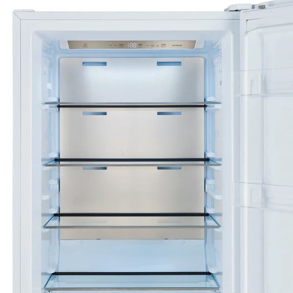 Interior view of the upper compartment in the FORNO Maderno 28-Inch Built-In 13.6 Cu. Ft. Convertible Refrigerator in white, featuring adjustable glass shelves and LED lighting.