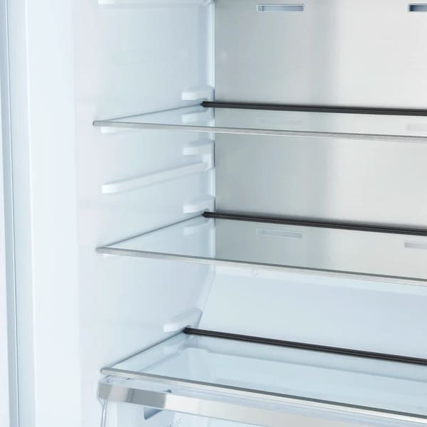 Close-up view of interior glass shelves in the FORNO Maderno 28-Inch Built-In 13.6 Cu. Ft. Convertible Refrigerator in white with left-swing door, showcasing adjustable, spill-resistant shelving and sleek design.