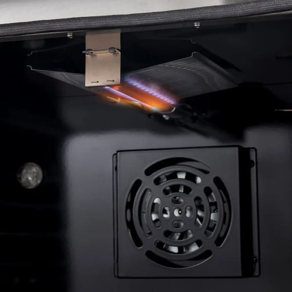 Close-up view of the active broiler flame inside the FORNO Marco 30-Inch Gas Range in white, highlighting the powerful upper heating element designed for high-temperature broiling and crisp finishes.