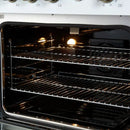 Right-angled interior view of the FORNO Marco 30-Inch Gas Range in white, featuring a blue enamel oven interior, convection fan, and adjustable chrome racks for multi-level cooking versatility.