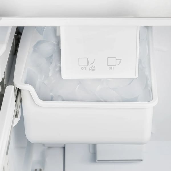 Close-up view of the built-in ice maker inside the Forno 36-inch French door refrigerator in white, featuring a compact design for efficient automatic ice production and convenient storage within the freezer compartment.