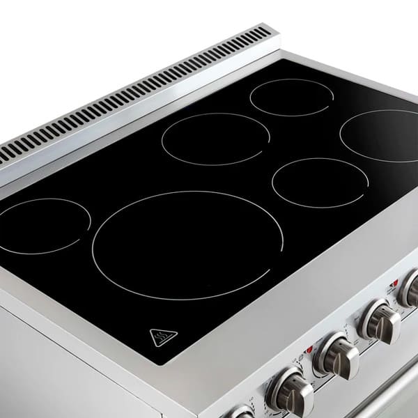 Angled top view of the Forno Paolo 36-Inch Electric Range, highlighting the sleek black ceramic glass cooktop with defined heating zones and stainless steel edging.