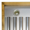 Close-up view of the built-in LED lights on the Forno Vittorio 48-Inch Wall Mount Range Hood in black, illuminating the cooktop area with bright, energy-efficient lighting beneath the matte black canopy and brass-accented design.