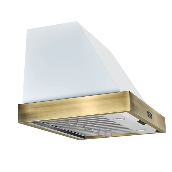 Left angle view of the Forno Vittorio Wall Mount Range Hood in a white finish, featuring antique brass trim, a tapered canopy design, and visible stainless steel baffle filters underneath for a stylish and functional kitchen centerpiece.