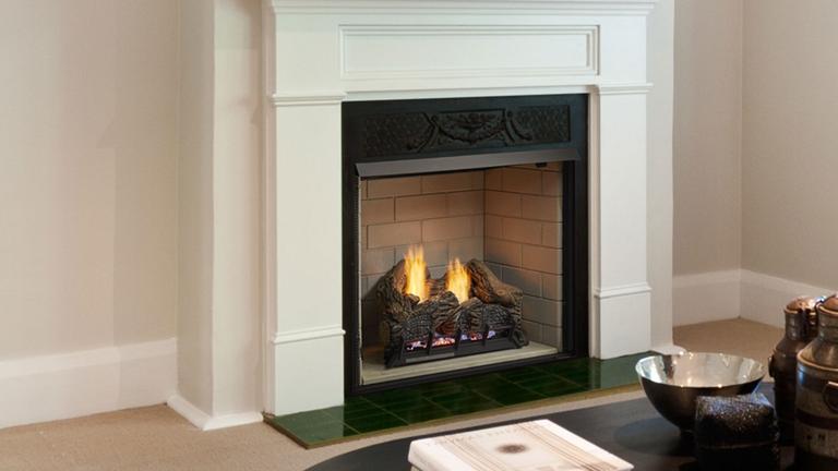 Monessen Lo-Rider clean-face vent-free firebox with cement gray liner in traditional living room