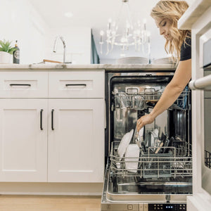 The ZLINE Dishwasher being used by the person